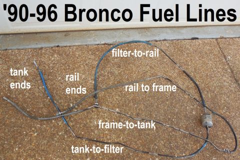 Labeled diagram photo of 1990-96 Bronco fuel lines laid out on concrete with filter