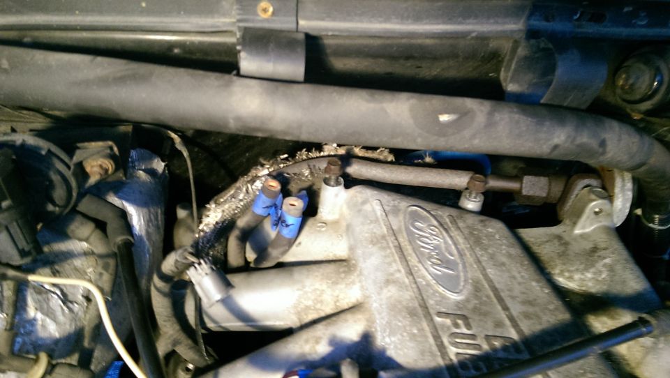 Ford F-series engine intake manifold with hoses and wiring