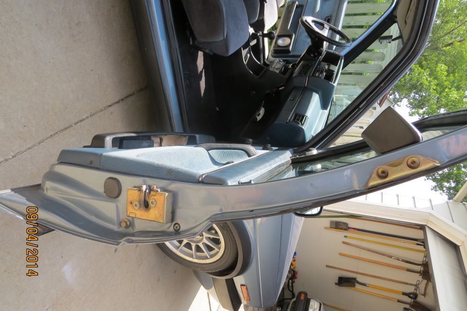 Blue 1990 Volkswagen Jetta interior, driver's side door open