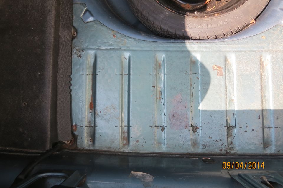 Trunk floor with spare tire visible
