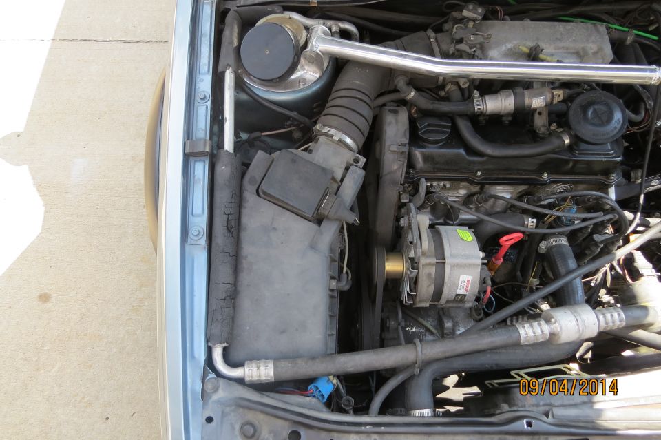 Engine bay with visible date stamp and SuperMotors logo