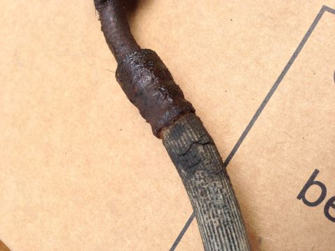 1979 Ford Bronco - This brake hose shows significant wear and cracking, indicating a need for replacement.