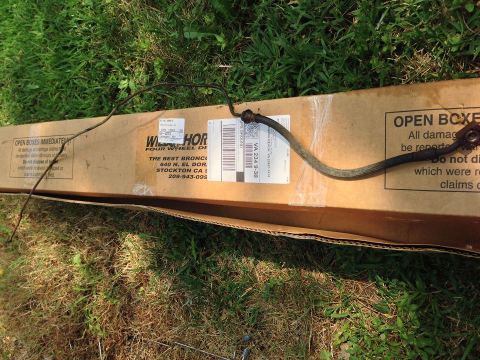 Brake hose resting on a cardboard box from Wild Horses Four Wheel Drive, Stockton CA
