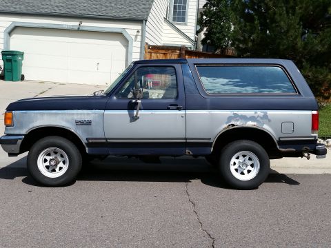1988 Ford Bronco - This Ford Bronco shows a two-tone paint scheme with significant wear and tear.