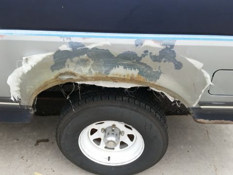 1988 Ford Bronco - Fiberglass repair material is peeling off the rear fender of a 1988 Ford Bronco.