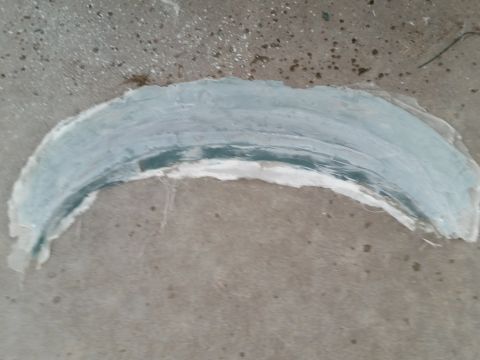 1988 Ford Bronco - Fiberglass repair in progress on a curved section, likely a body panel or part.