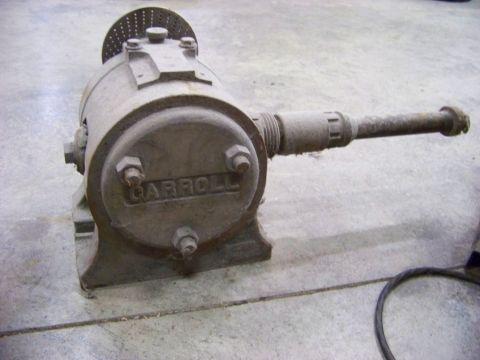 1995 Mercury Grand Marquis - A dusty industrial pump, identified by the 'CARROLL' casting, is shown from a 3/4 front perspective.