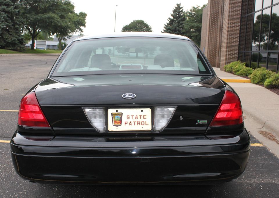 Black 2009 Ford Crown Victoria rear with State Patrol license plate