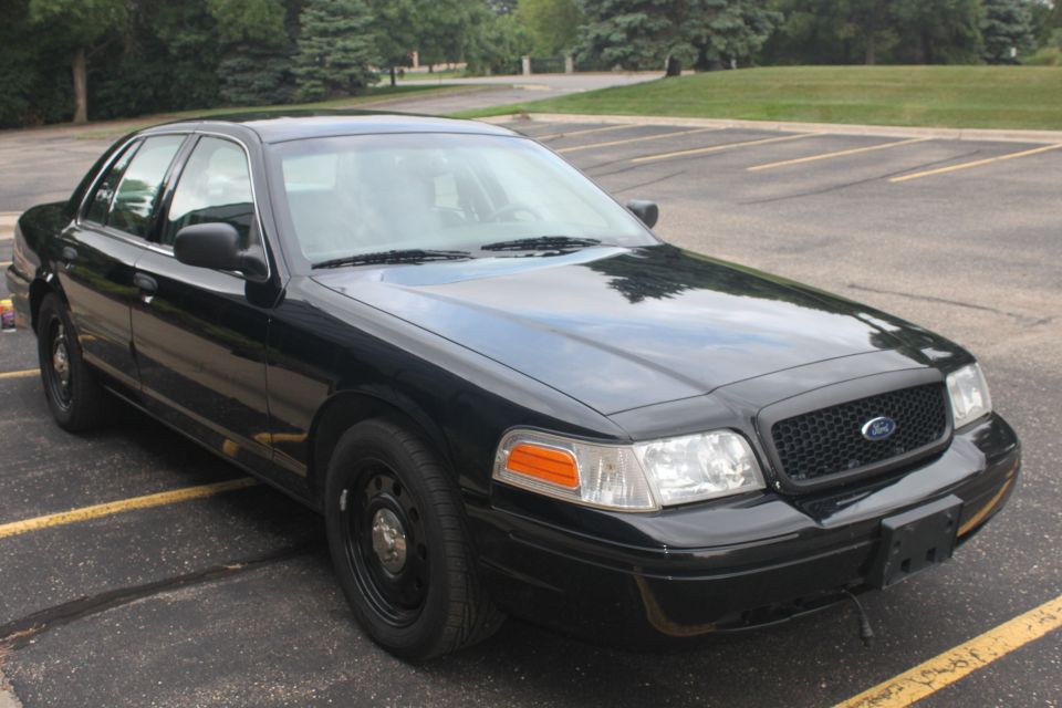 Black 2009 Ford Crown Victoria sedan, front quarter view