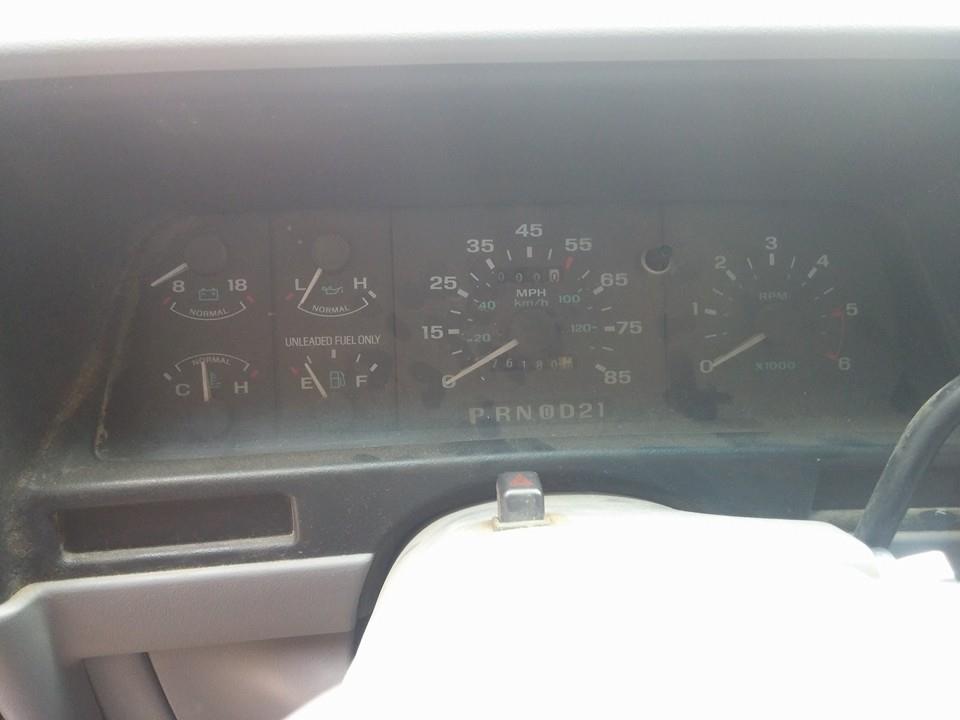 Dashboard gauges with odometer reading 76184, fuel, temperature, and tachometer. P R N D 2 1 gear indicator