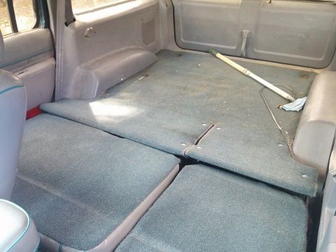 2000 Mercury Grand Marquis - The folded rear seats create a large cargo area in this vehicle's interior.