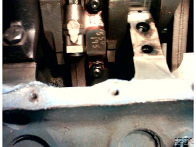 1973 Ford Ranchero - Close-up of an engine crankshaft bearing showing stamped numbers '550 195'.