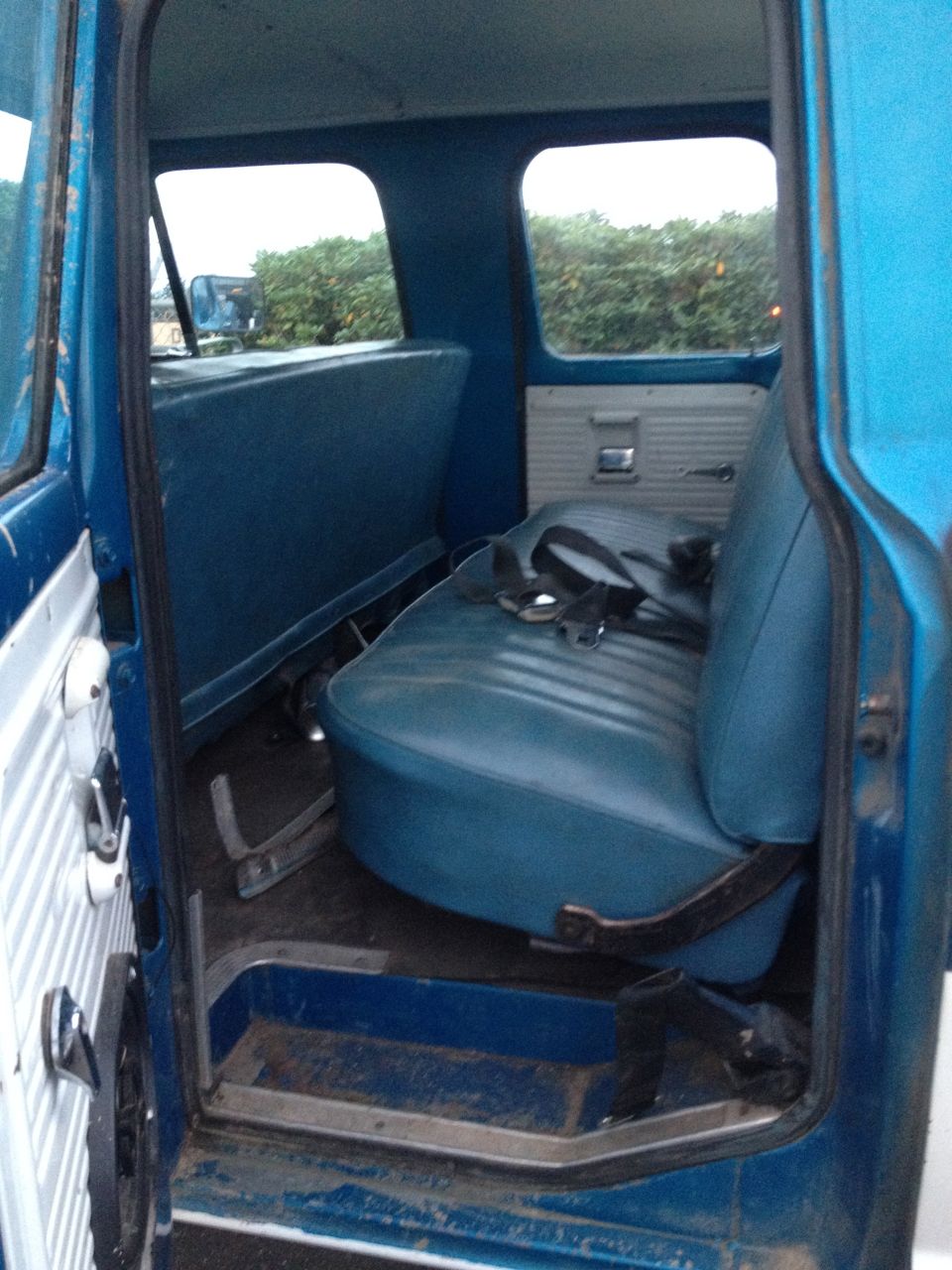 1971 Ford F-250 interior showing blue vinyl bench seat and door panel