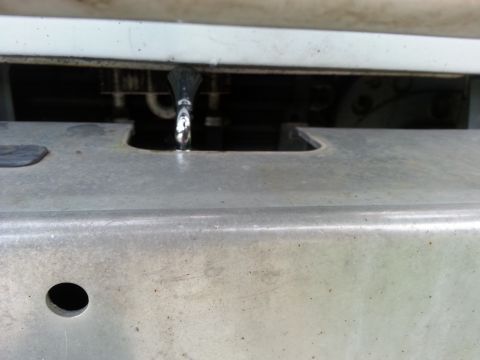 1992 Ford Bronco - this is the clearance for the winch lever. It's tight, but I can still get my hand in there to turn it. The original hole in the bumper had…