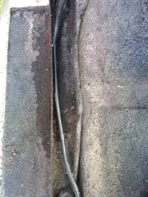 1992 Ford Bronco - The door threshold seal shows signs of wear and tear, with accumulated dirt and grime.