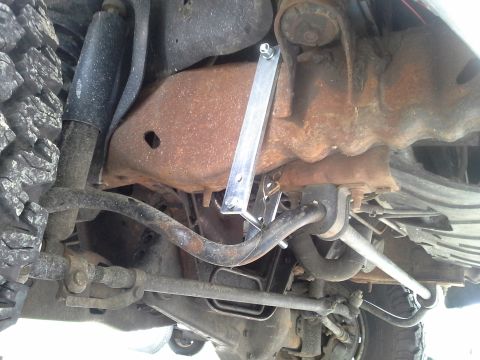 1996 Ford Bronco - Its best to attach the bracket up front and slide it back because of the inner fender being in front of the top bolt