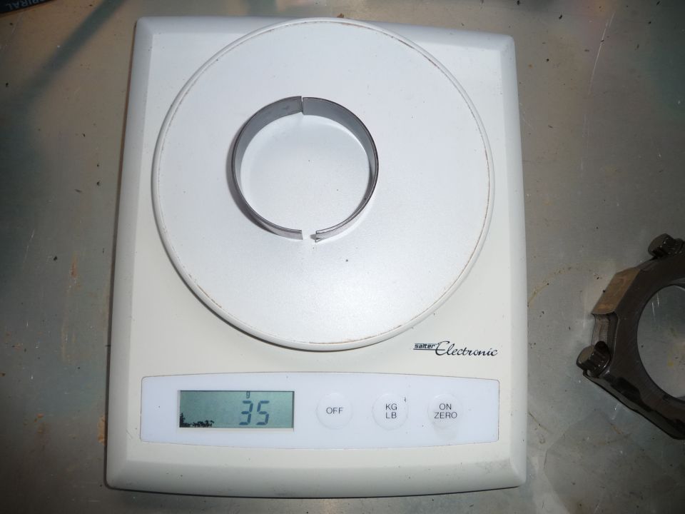 Piston ring on a digital scale showing 35