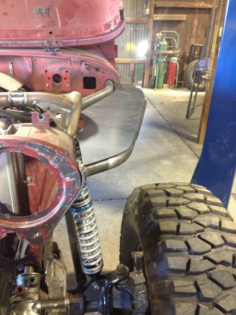 1985 Jeep CJ7 - Custom fabrication on a 1985 Jeep CJ7 front end, showing suspension and a large tire.