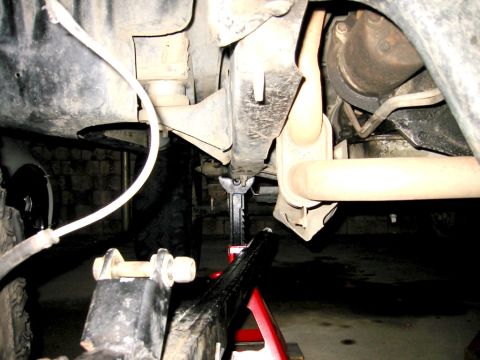 1985 Ford Bronco - Vehicle is on jack stands, indicating maintenance or repair work is in progress.