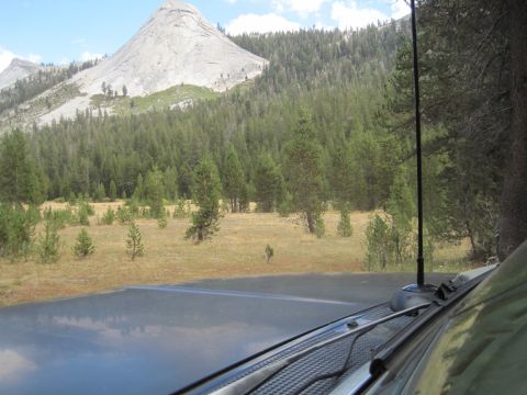 1989 Ford Bronco - A scenic view of a mountain and forest, seen from the perspective of someone inside a vehicle.