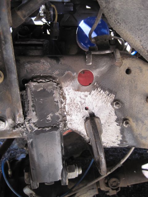 1989 Ford Bronco - Vehicle frame shows evidence of repair work, including welding and grinding.