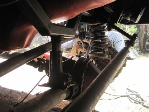 1989 Ford Bronco - Close-up view of the undercarriage, focusing on the suspension and differential components.