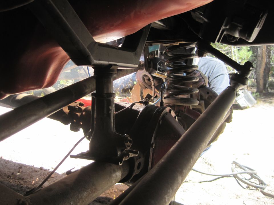 Undercarriage view of vehicle suspension and differential
