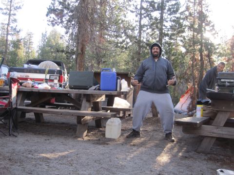 1989 Ford Bronco - Two men enjoy a day at a campsite with a picnic table and a pickup truck.
