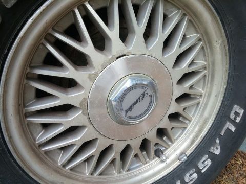 2000 Mercury Grand Marquis - Close-up of a vehicle's wheel and tire, showing the 'Limited' trim designation on the center cap.