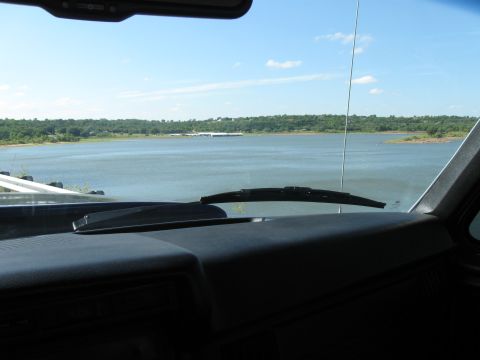 1982 Ford Bronco - Looking out over a large body of water from inside a vehicle on a sunny day.