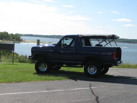 1982 Ford Bronco - This 1982 Ford Bronco is seen parked near a body of water on a sunny day.