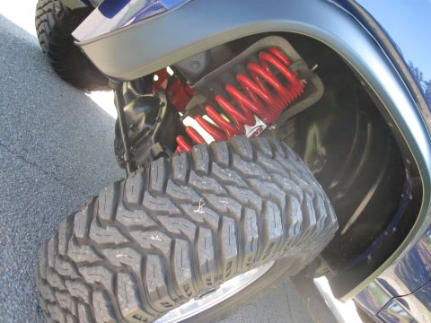 1982 Ford Bronco - This image shows the suspension and tire of a vehicle, not a specific model year.