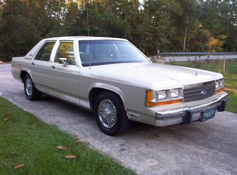 1990 Ford Crown Victoria LTD - This sedan has a boxy body style typical of Ford sedans from the early 1980s.
