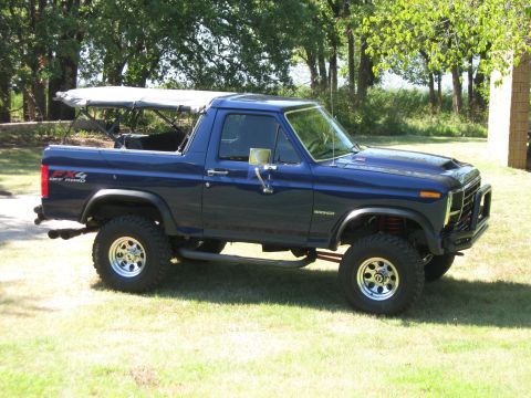 1982 Ford Bronco - This 1982 Ford Bronco features a lifted suspension and off-road tires, with a soft top installed.