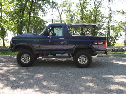1982 Ford Bronco - This blue 1982 Ford Bronco features a removable soft top and FX4 off-road badging.