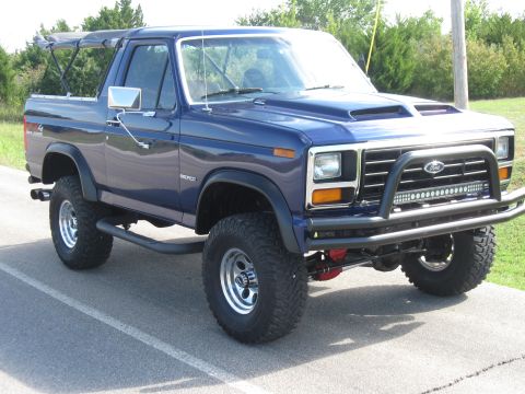1982 Ford Bronco - This modified Ford Bronco features a custom hood scoop and front bumper with an LED light bar.