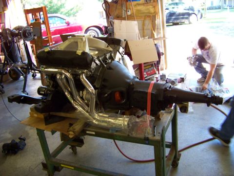 1974 Dodge Challenger - Engine and transmission assembly, likely for a classic car, is prepped for installation.