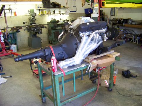 1974 Dodge Challenger - Engine and transmission assembly on a cart in a workshop, ready for installation.