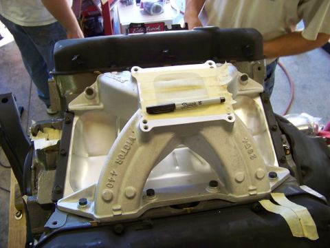 1974 Dodge Challenger - Close-up of an engine intake manifold, identified as 'VICTOR 440', with a marker on tape.