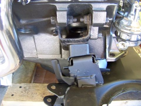 1974 Dodge Challenger - Close-up of an engine mount and fuel pump assembly.