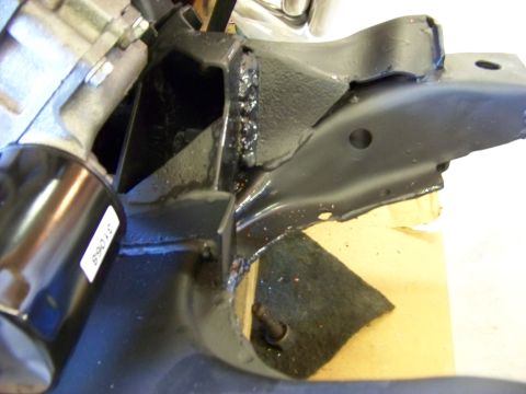 1974 Dodge Challenger - Close-up view of an engine mount bracket, showing welds and a sticker with the number 31068.