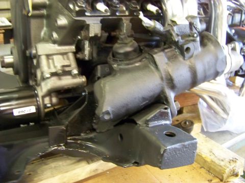1974 Dodge Challenger - Close-up view of an engine block and steering gearbox assembly.