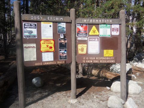 1968 Ford Bronco - Information boards at a trailhead provide warnings and regulations for visitors.