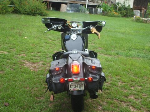 1998 Honda Shadow VT750C - This motorcycle is equipped with large, studded saddlebags and a windshield.