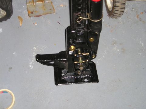 1996 Ford Bronco - A black Hi-Lift Jack is shown with its base and mechanical parts visible.