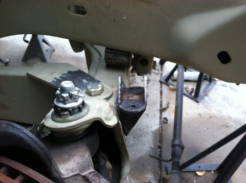1995 Ford Bronco - Undercarriage view of vehicle suspension components, possibly during repair or modification.