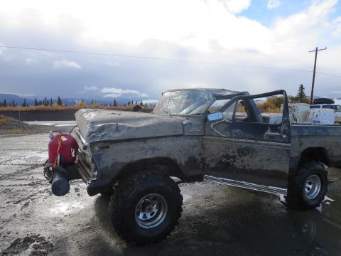 1990 Ford F-250 - This heavily damaged Ford F-Series truck appears to be from the 1970s, not the 1990s as claimed.