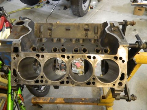 1979 Ford Bronco - Engine block on a stand, with visible cylinder bores and mounting hardware.