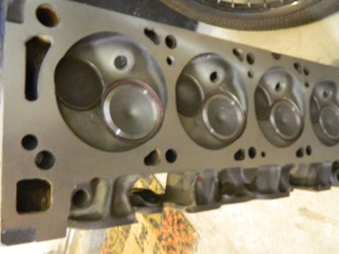 1979 Ford Bronco - Close-up view of an engine cylinder head, showing multiple combustion chambers and valves.