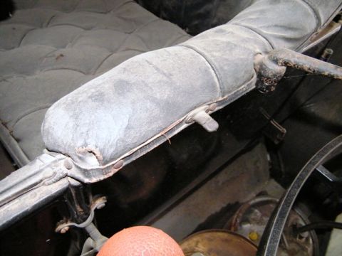 1912 Ford Model T - Dust covers the interior of this antique automobile, obscuring details of its age and model.